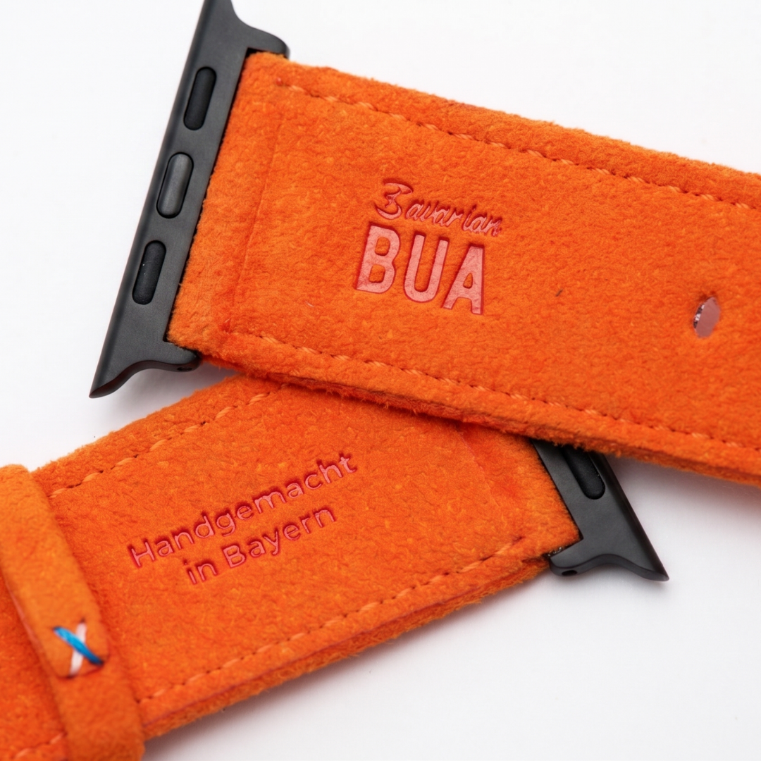 Oranges Alcantara Armband für Apple Watch Ultra mit Bavarian Bua Logo und handgemachter Prägung aus Bayern